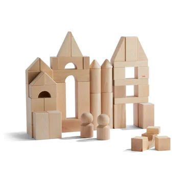 Stacked wooden building blocks forming a small castle.