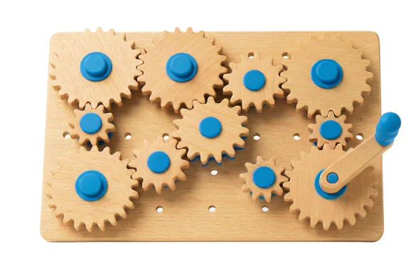 A wooden board of interlocking gears with blue hubs.