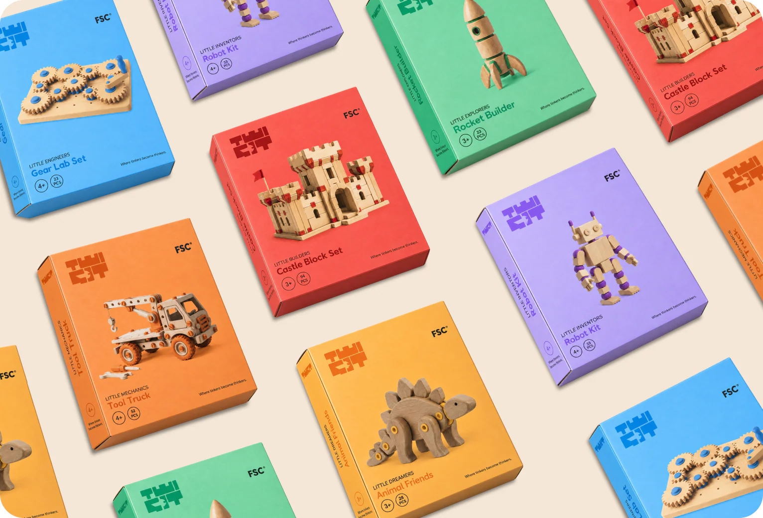 Six coloured TWIGIT boxes on a shelf.